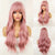 Voluminous Long and Wavy Pink Hair Wigs with Bangs