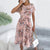 Chic Floral Print Short Sleeve Pleated Dress with Lace-Up Detail