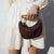 Classy Women's Half-Moon Woven Straw Shoulder Bag with Twist Handle