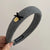 Textured Knitted Headbands with Small Black Bow and Gold-tone Charm