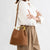 Women's Suede Bucket Bag with Elegant Gold-Toned Metal Handle
