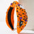 Wide Knotted Halloween Headband Embellished with Festive Pumpkins