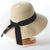 Chic Wide Brim Floppy Straw Sun Hat with Oversized Black Bow